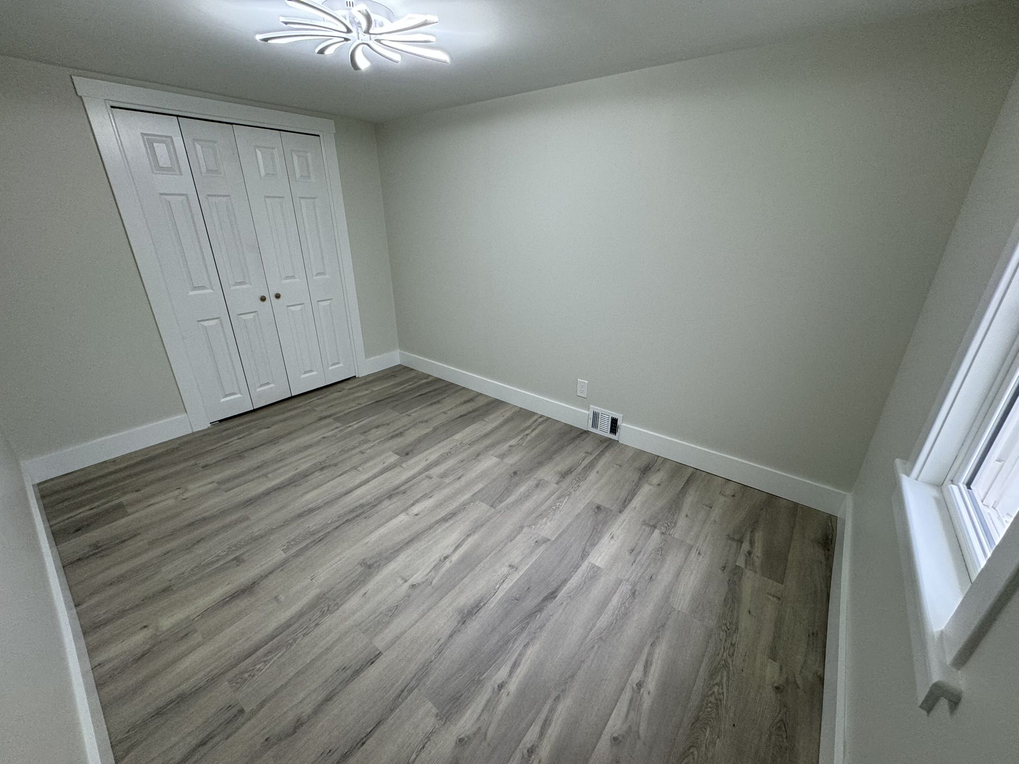 Finished basement room with waterproof luxury vinyl plank flooring in a Myerstown PA home