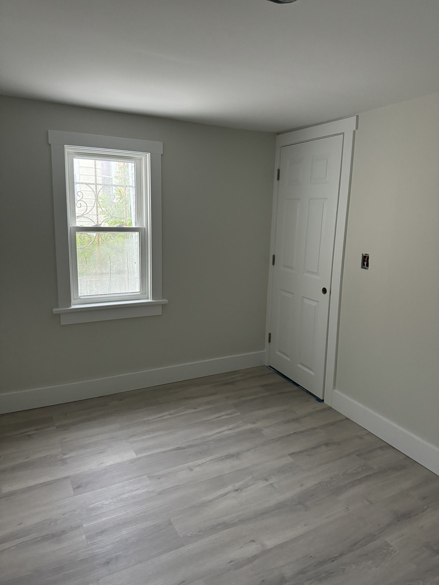 Freshly finished bedroom with new flooring and trim work in a Cornwall, PA area home